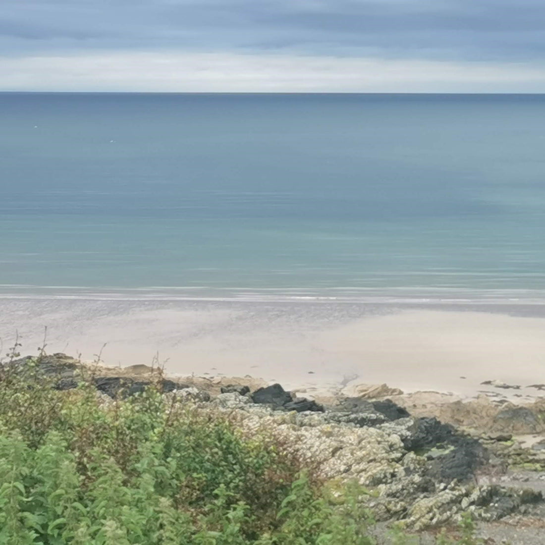 Beach with blue sea and sky.