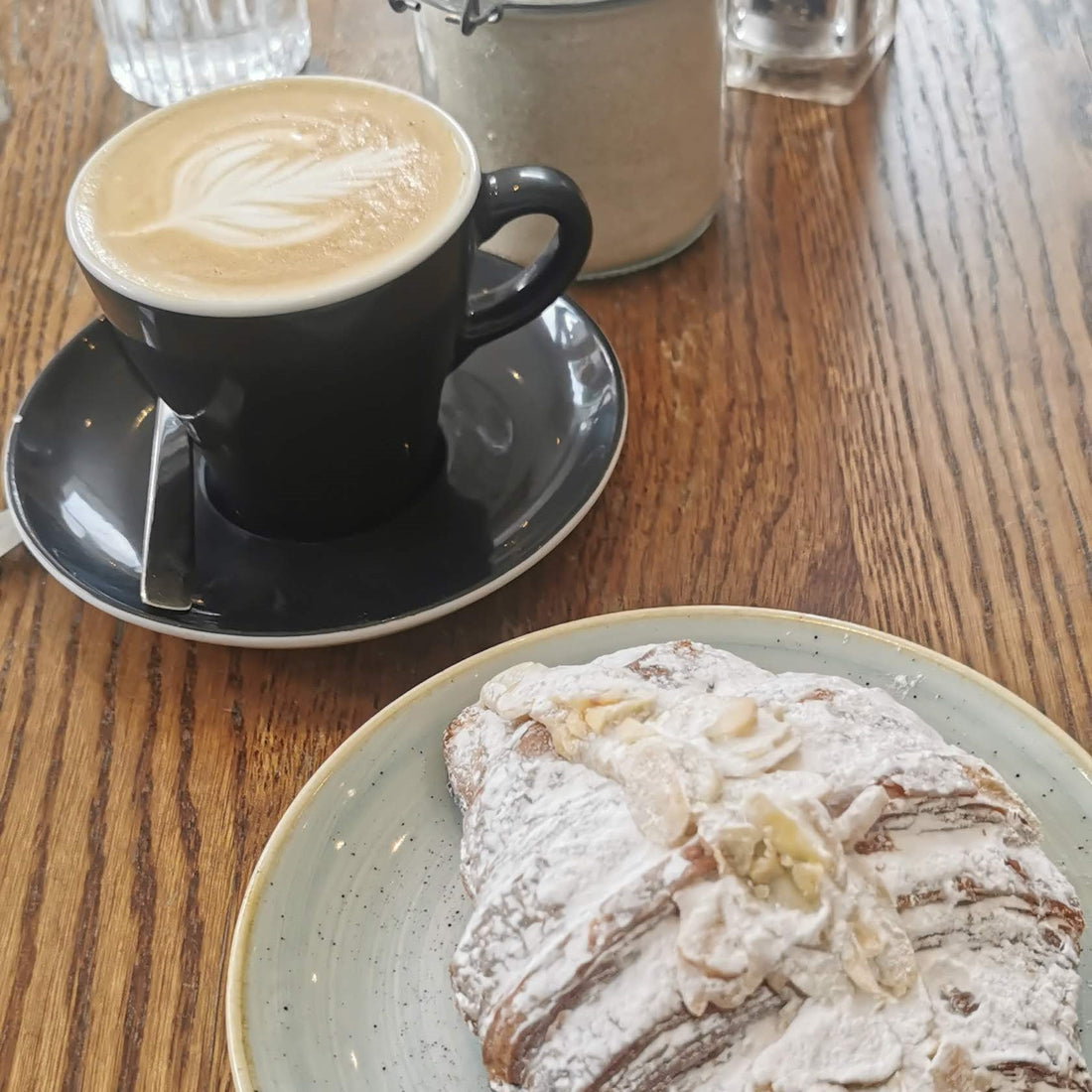 Artisan coffee and almond croissant.