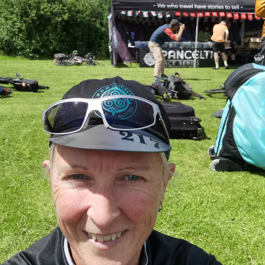 Elaine at the finish wearing a Pan Celtic cap and glasses.