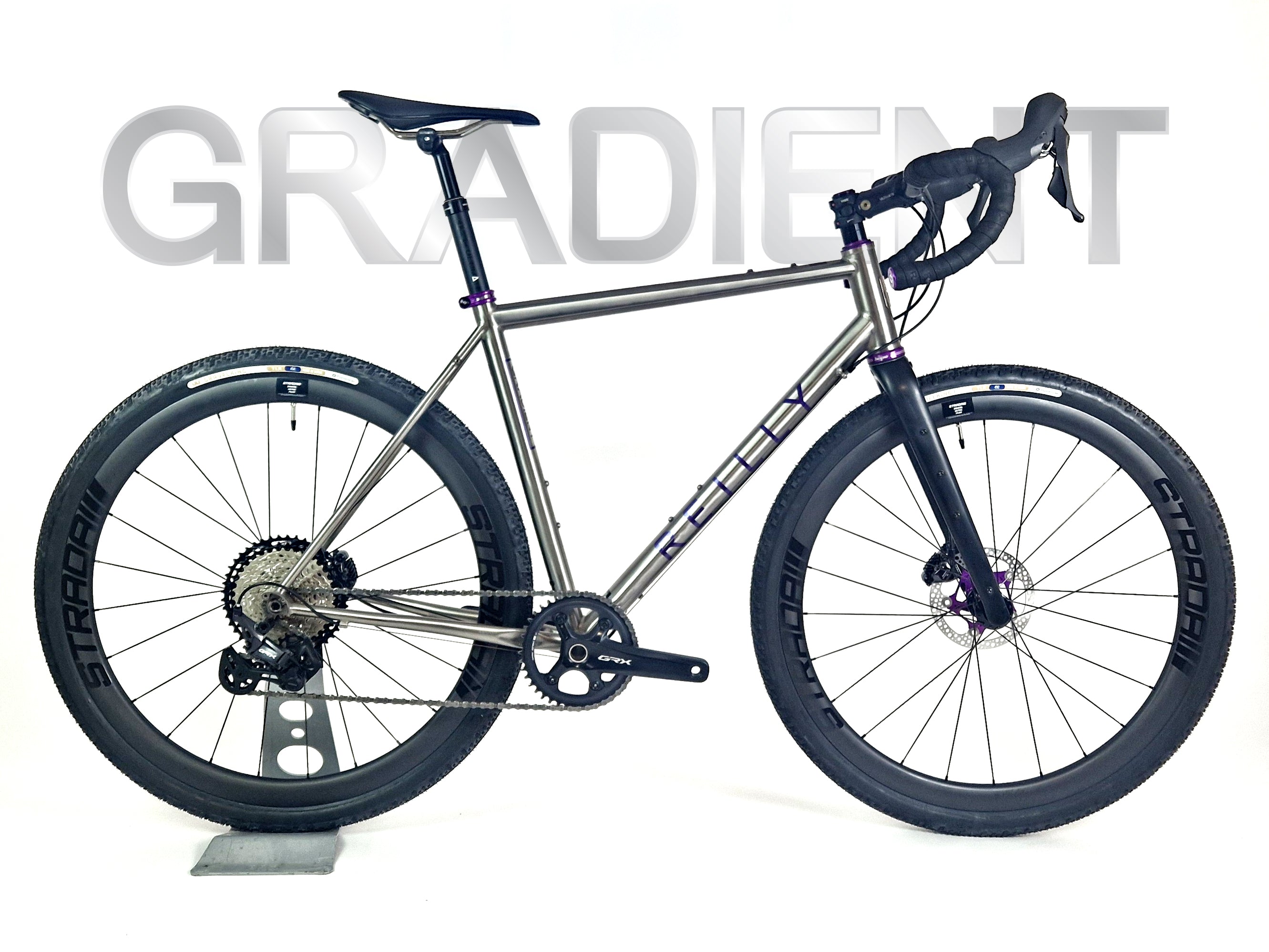 Titanium gravel bike in side profile.