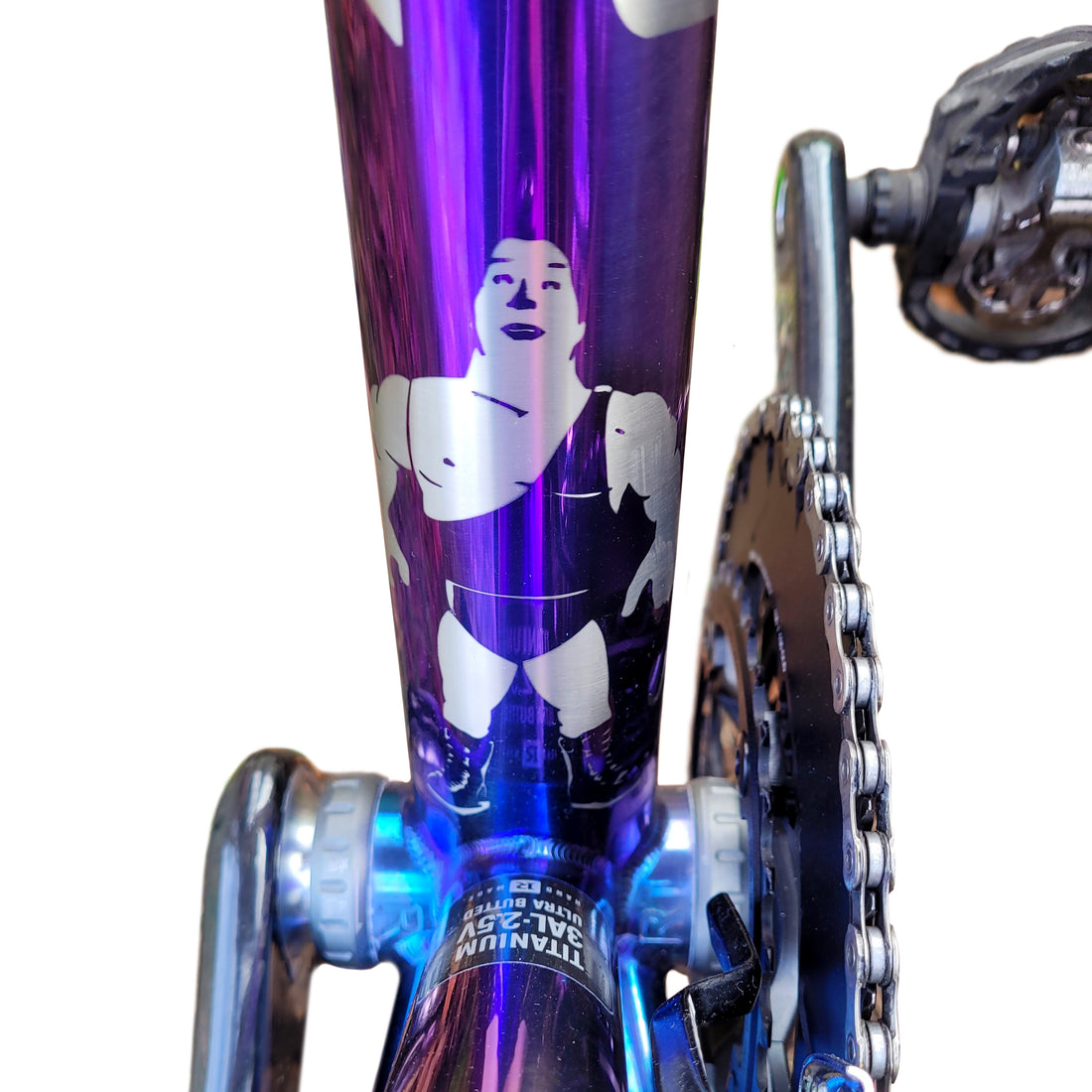 Strong man anodised on to a titanium bike. 