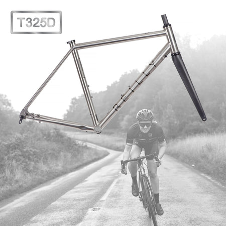 A frameset with a female cyclist in the background in black and white.